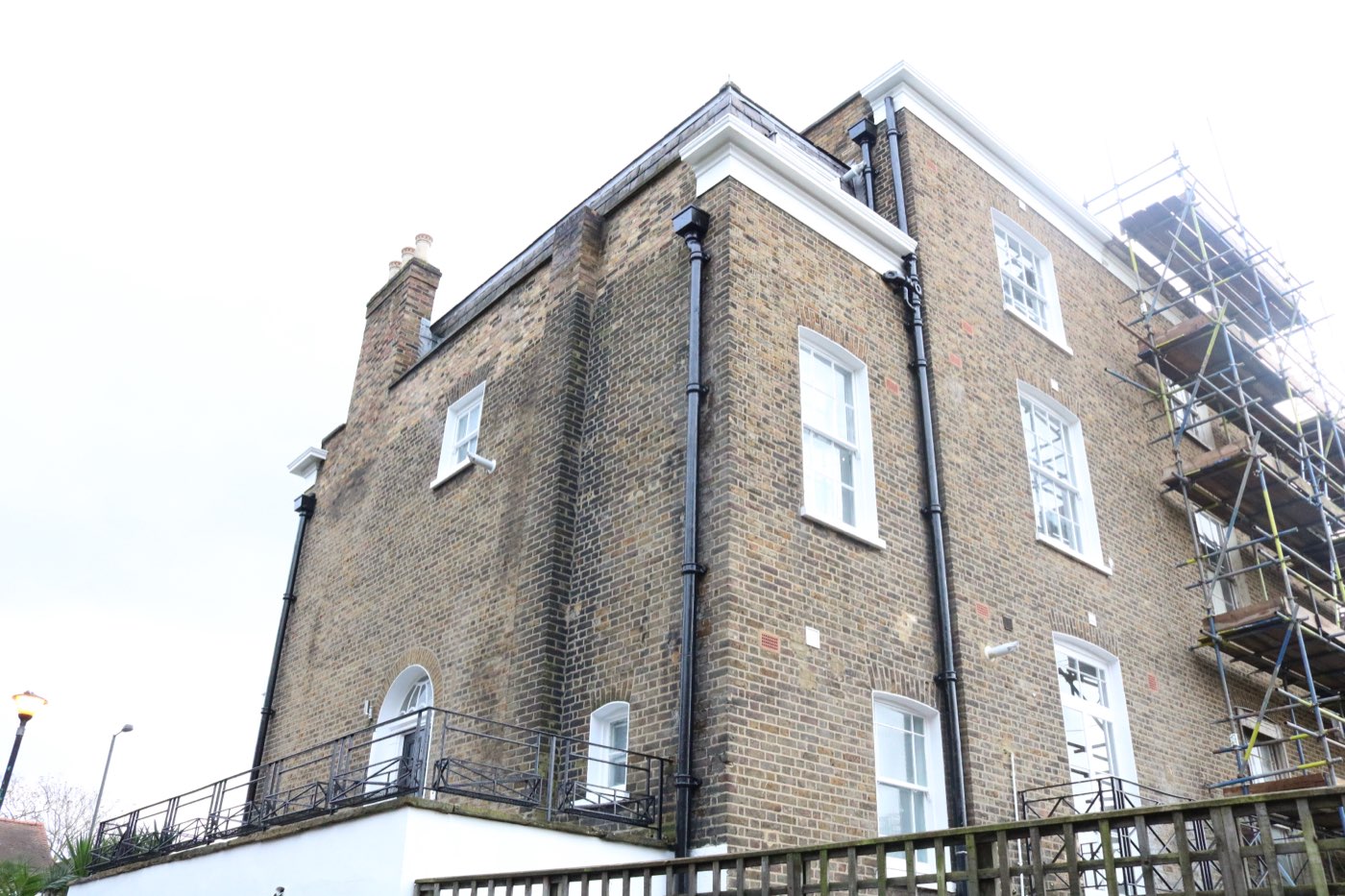 Scaffolding on a period brick building during LINX's renovation at Mitchem Road