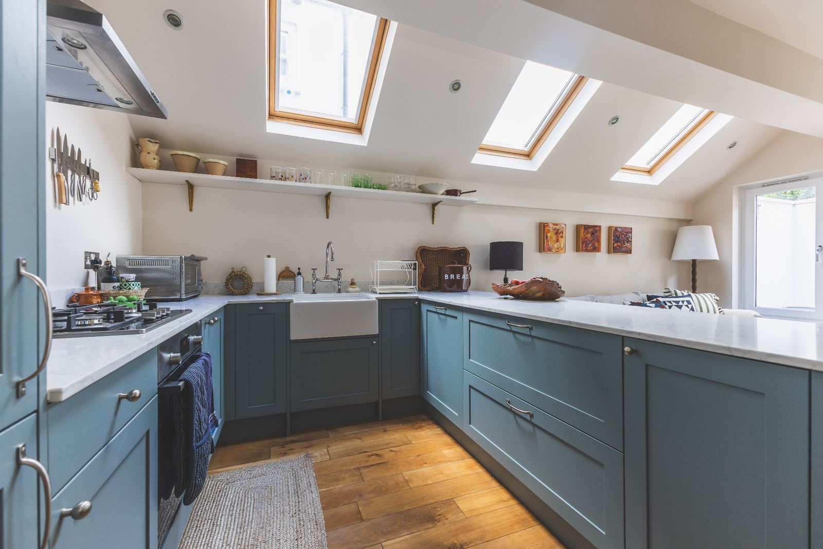 Kitchen lit by three roof lights in a LINX extension